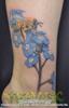 Realistic ankle tattoo